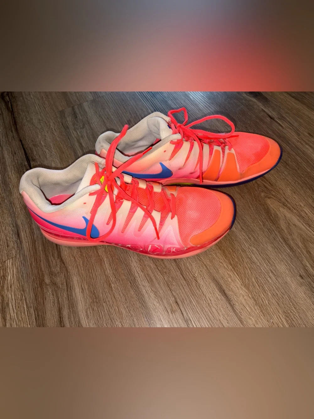Nike Men's ' Pink/Coral Athletic Shoes with Blue Swoosh